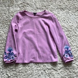 Woman’s long sleeves sweater- blouse.